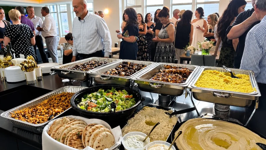 Saj Fresh Grill halal Mediterranean catering buffet with shawarma rice salad hummus and pita for Aurora Denver and DTC events
