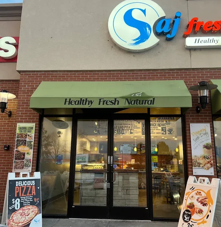 front1 Saj Fresh Grill Mediterranean restaurant storefront in Aurora Colorado featuring fresh shawarma, falafel, hummus, halal food, Palestinian cuisine, takeout, dine in and catering services near Parker Road.